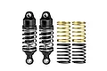 Two black GPM Racing adjustable RC shock absorbers with silver springs installed, plus two additional pairs of spare springs in gold and black.
