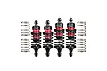 A set of four GPM Racing aluminium RC shock absorbers in red and black, with two additional loose springs on each side.