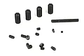 A collection of various sizes of black metal grub screws scattered on a white background.