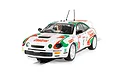 Scalextric 1/32 scale Toyota Celica GT-Four rally slot car in white, green, and red Castrol livery on a track.
