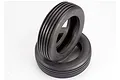 Two black rubber RC monster buggy front tyres with a ribbed tread pattern stacked on a white background.