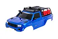 A blue Traxxas TRX-4 Sport RC crawler body shell with a black roof rack, snorkel, and red fuel canisters, shown against a white background.