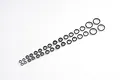 A collection of various sized metal ball bearings arranged in two rows on a plain white background.