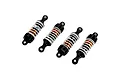 Four Maverick RC shock absorbers with orange aluminium bodies, black plastic ends, and white coil springs arranged diagonally on a white background.