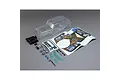 Losi 1/8 LMT Son Uva Digger clear RC truck body shell with decal sheet and plastic accessories on a grey background.