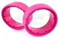 Two bright pink molded foam tyre inserts for RC buggies, shown in a studio setting.