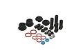 A collection of black plastic shock components, red and blue O-rings, and small metal nuts for a Pro-Line RC shock rebuild kit.