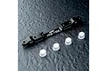 A black MST aluminium adjustable lower suspension arm mount with four small white plastic inserts on a dark textured surface.