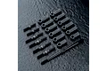A set of black MST RC turnbuckles and rod ends arranged on a dark textured surface.