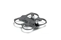 A grey plastic drone frame with integrated propeller guards, shown from a high-angle perspective against a white background.