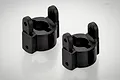 Two black plastic steering hub carriers for an RC car, shown from a high angle against a white background.