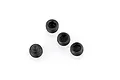 Four small black metal grub screws with hexagonal drive sockets arranged on a white background.