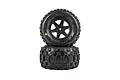 Pro-Line Badlands MX tyres mounted on black Desperado rims, stacked vertically against a pure white background.