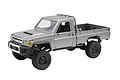 Studio product shot of a silver MN Model Toyota LC79 Pro RC rock crawler electric truck on a white background.