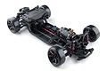 Top-down studio view of the MST FRX S FR 1/10 scale electric 2WD RC drift car chassis kit on a white background.