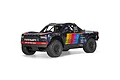 ARRMA MOJAVE 6S 1/7 scale 4WD RC short course truck in blue with colorful retro racing livery against a white background.