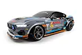 Studio shot of the HPI Stage-D10 Ford Mustang GT RC drift car in grey with AutoZone livery and illuminated headlights against a white background.