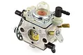 A Zenoah Walbro 2-stroke carburettor featuring a clear primer bulb, metal body, and various fuel inlet and adjustment fittings.