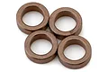 A close-up studio shot of four copper-coloured metal bushings arranged in a cluster against a plain white background.