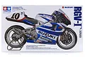 Tamiya 1/12 scale Suzuki RGV-T (XR89) motorcycle model kit box art featuring a blue and white racing bike with number 10.
