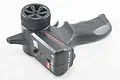 WPL 2.4Ghz pistol-grip radio transmitter featuring a black plastic housing, steering wheel, trigger, and control panel with an on/off switch.