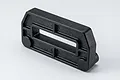 Black moulded plastic RC spare part with a central rectangular cutout and reinforced framing on a white background.