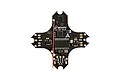 BetaFPV F4 Brushless Flight Controller circuit board with black PCB, surface-mount components, and attached red wire antenna.