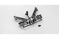 Kyosho long wing mount parts tree and small screws on a plain white background.