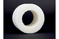 A white, cylindrical soft foam tyre insert for an RC monster truck, shown against a plain dark grey background.