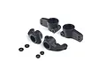 A set of four black plastic RC steering blocks and rear hubs with four small washers on a white background.