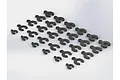 A collection of black plastic C-clip suspension spacers of varying sizes arranged on a white background.
