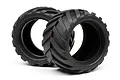 Two black rubber RC monster truck tyres with a deep chevron tread pattern, shown against a white background.