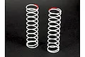 Two white ARRMA RC shock springs standing upright on a dark surface, each featuring a red paint mark on the top coil for identification.
