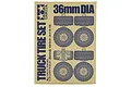 Cardboard packaging for Tamiya 36mm Truck Tire Set featuring blue line art illustrations of the tires and wheels on a tan background.