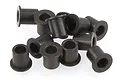 A pile of twelve small black flanged steering hub bushings for RC vehicles.