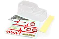 Unpainted clear polycarbonate RC truck body shell with included decal sheet and masking tape on a white background.