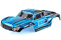 A pre-painted blue and black RC short course truck body shell with Storm Brushless branding on the side, isolated on a white background.