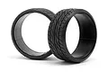 Two black HPI Racing RC drift tyres with Dunlop Le Mans LM703 tread pattern, shown against a white background.