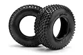 Two black HPI Racing Blitz ATTK short course RC tyres with aggressive tread patterns, shown from a side-angle view on a white background.