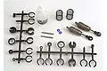 Traxxas Big Bore aluminium shock absorber kit including two shock bodies, springs, silicone oil, and plastic parts trees on a white background.