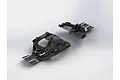 Two black molded plastic RC car chassis components, likely a front steering skid plate and a rear skid plate, shown against a plain white background.