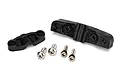 Traxxas DCB M41 stuffing tube mount parts including two black plastic mounting brackets and four silver metal hex screws on a white background.