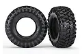 Two black Traxxas 1.9-inch Canyon Trail RC crawler tires with aggressive tread patterns and foam inserts, shown against a white background.
