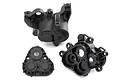 Three black plastic Traxxas TRX-4 gearbox housing components shown from different angles on a white background.