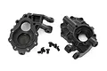 Traxxas TRX-4 front inner portal drive housings, left and right, with five small black mounting screws on a white background.