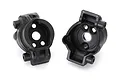Two black plastic Traxxas TRX-4 rear inner portal drive housings shown from the interior side against a white background.