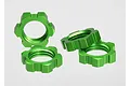 Four bright green anodized aluminium splined wheel nuts for Traxxas RC vehicles arranged on a white background.