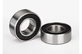 Two Traxxas rubber-shielded ball bearings shown against a plain white background.