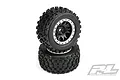 Two Pro-Line MX43 Badlands monster truck tires mounted on black and silver Impulse Pro-Loc beadlock wheels, stacked vertically against a white background.