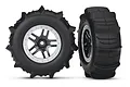 Two Traxxas 2.2/3.0 inch sand paddle tires pre-glued to black and silver split-spoke wheels, shown from front and side angles.